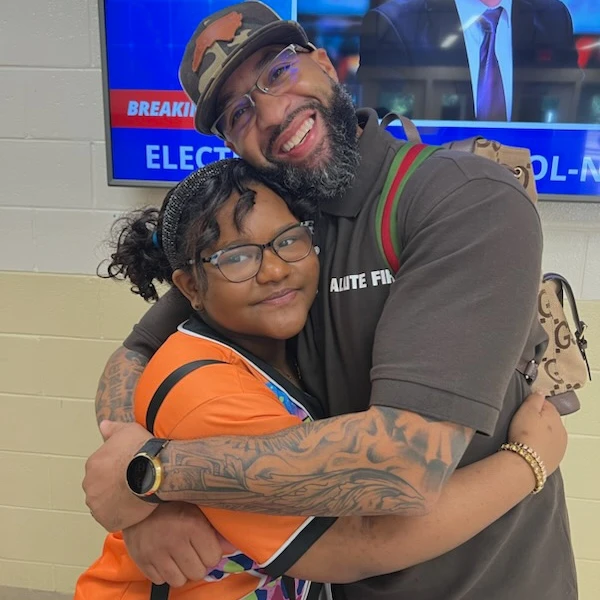 Kendall-hugging-a-student